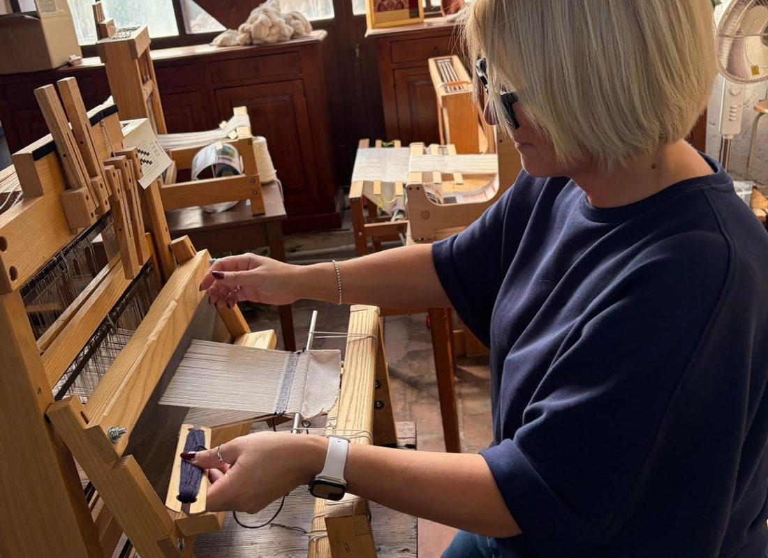 Handweaving on a traditional wooden loom