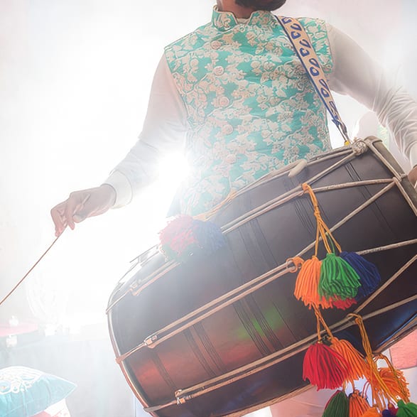 Dhol drummer performing at an Indian Summer evening
