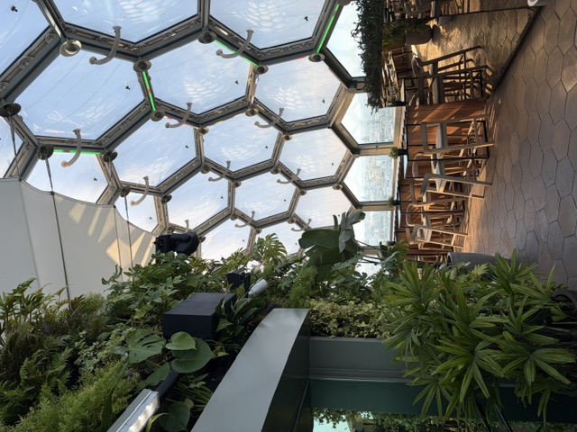The honeycomb glass dome ceiling of the Babylon360 venue at the top of the Vasco da Gama Tower, framing views over Lisbon